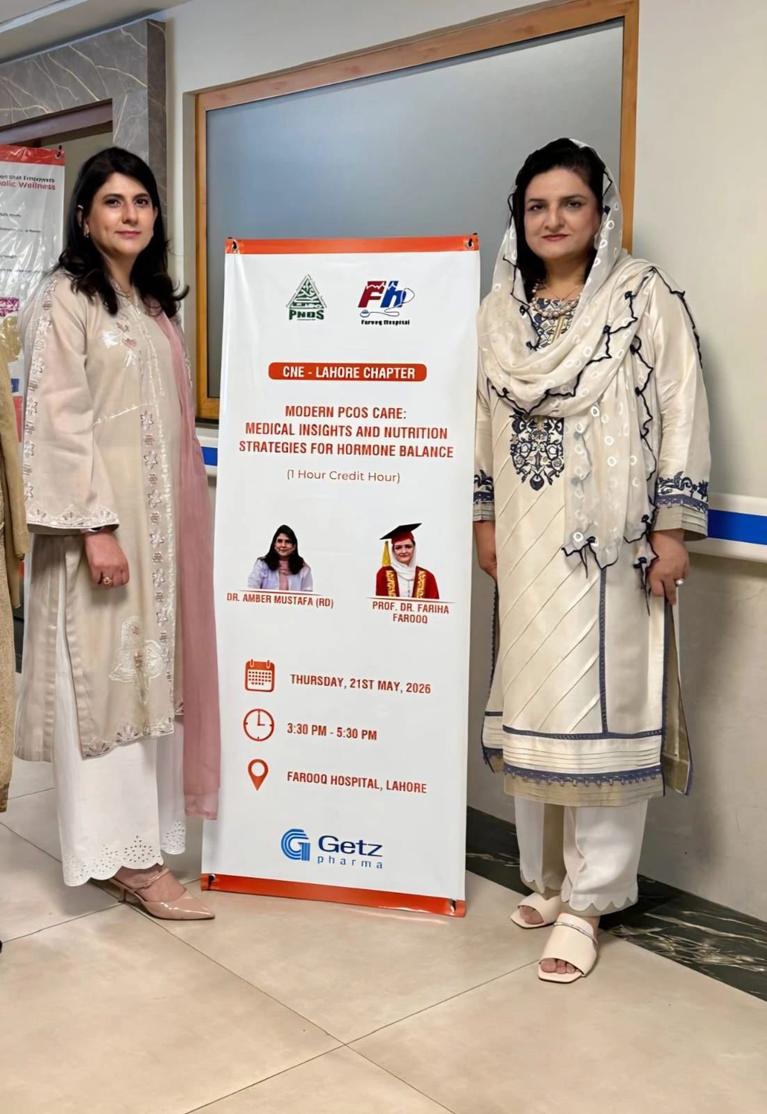 Amber Mustafa, RD and Prof. Dr. Fariha Farooq beside the CNE session banner at Farooq Hospital, Lahore